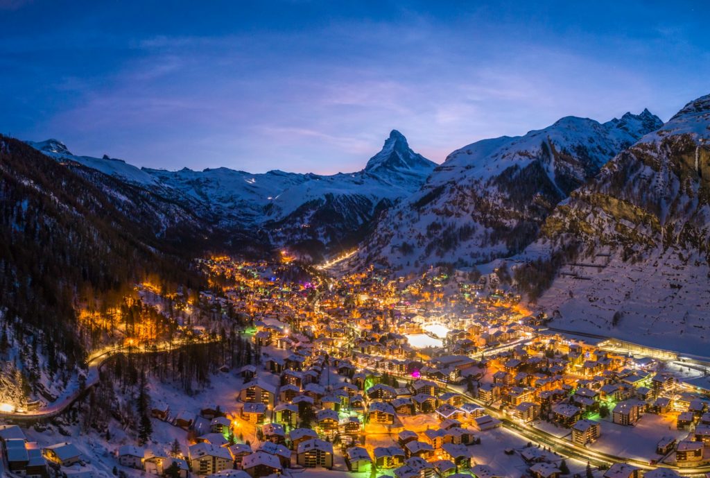 Zermatt Town and Matterhorn Mountain at Winter Night. Swiss Alps, Switzerland. Aerial View